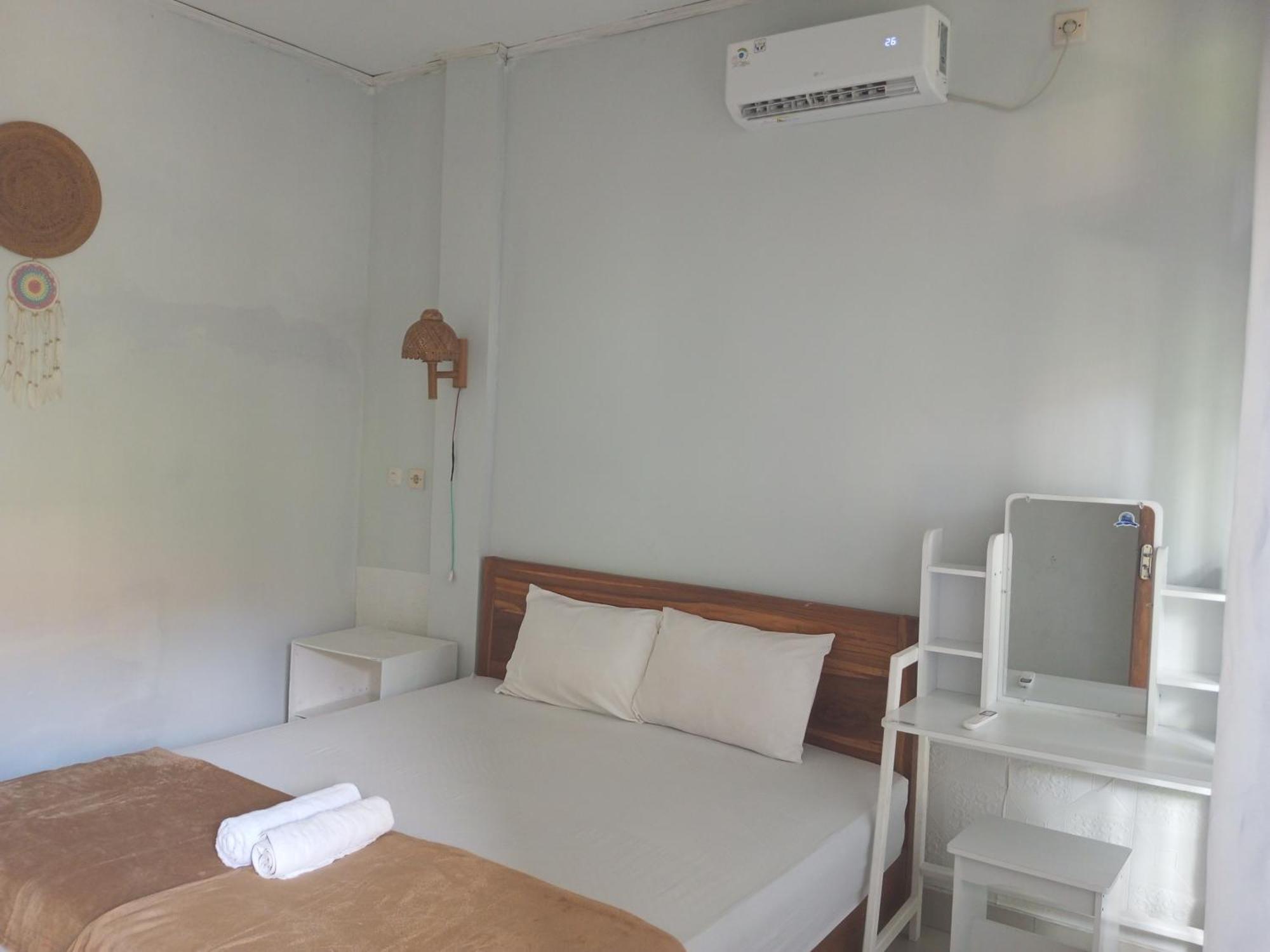Kri Homestay Kuta  Pokoj fotografie