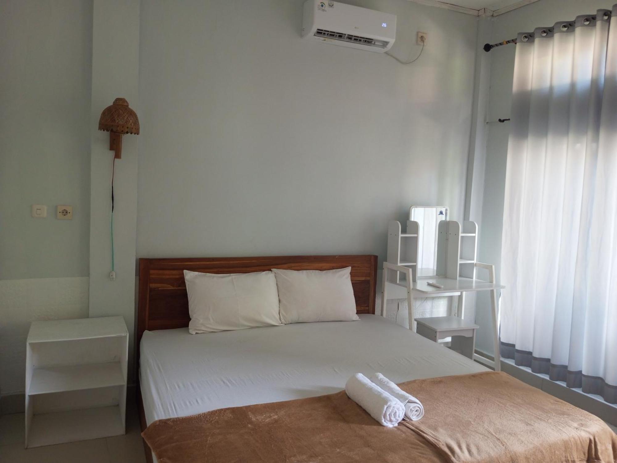 Kri Homestay Kuta  Pokoj fotografie