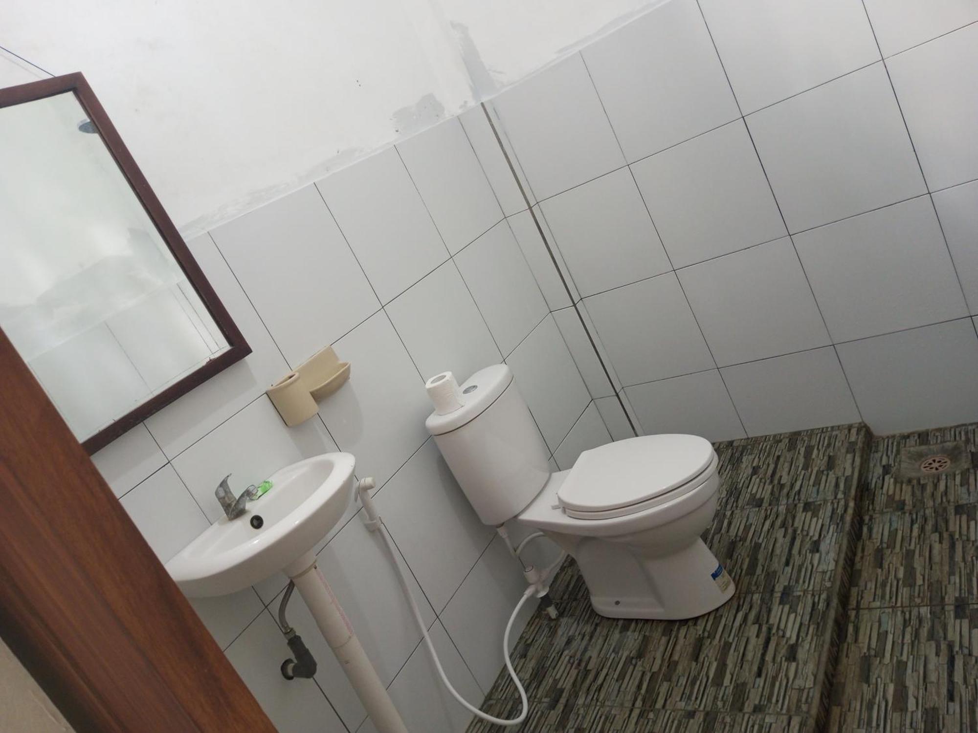 Kri Homestay Kuta  Pokoj fotografie
